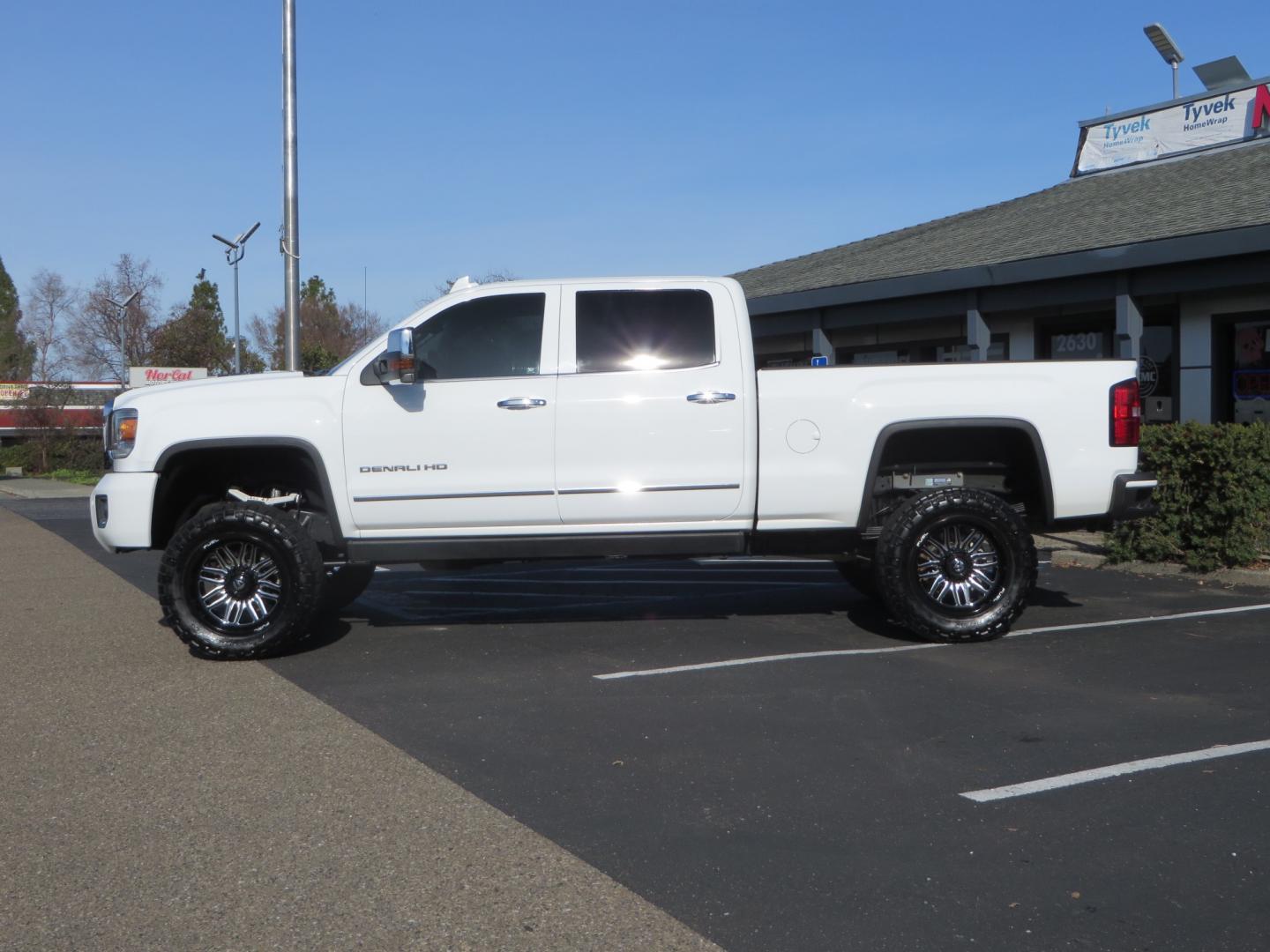 2015 White GMC Sierra 2500 HD Crew Cab Denali (1GT120E88FF) with an V8 Turbo Dsl 6.6L engine, Auto 6-Spd Allison OD transmission, located at 2630 Grass Valley Highway, Auburn, CA, 95603, (530) 508-5100, 38.937893, -121.095482 - 2015 GMC Denali 2500 6.6L Duramax Diesel. Cognito 4-6" lift kit, Cognito traction bars, Cognito idler and pitman support, Kryptonite upper control arms, Fox remote reservoir shocks, Amp power steps, Fuel Offroad wheels, Nitto Ridge Grappler tires, Alpine Stereo Firestone ride rite air bags, Transfer - Photo#7